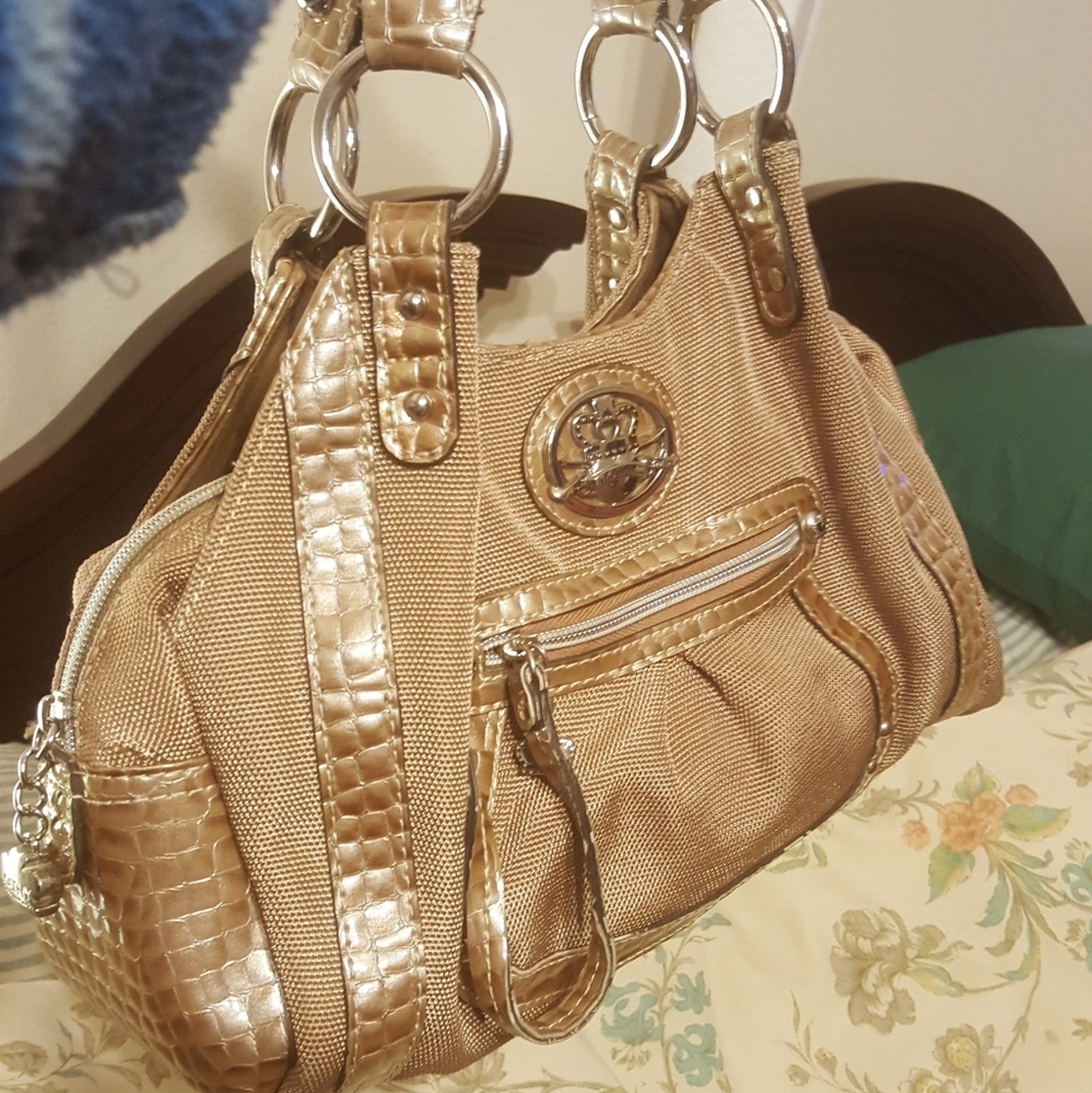 Kathy Van Zeeland gold handbag